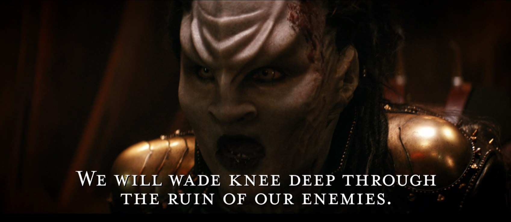 The meme is a split-screen image of the Star Trek character Worf from the TV show "Deep Space Nine" with a serious expression. On the top half, it says "We will not be moved" and on the bottom half, it says "We will not be moved, we will be destroyed".